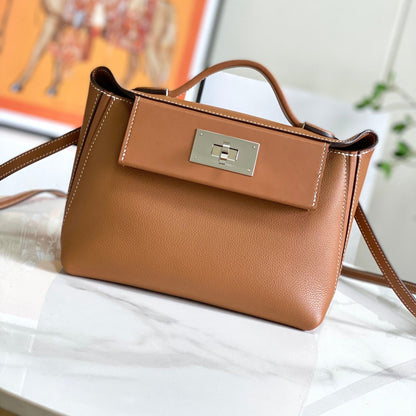 Bolso mini HM 24/24 de 21 cm, piel Evercolor dorada, herrajes plateados