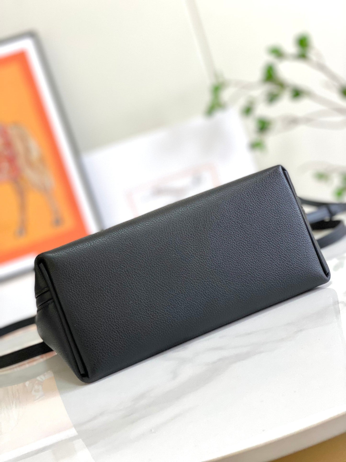 Bolso mini HM 24/24 de 21 cm, piel Evercolor negra, herrajes dorados