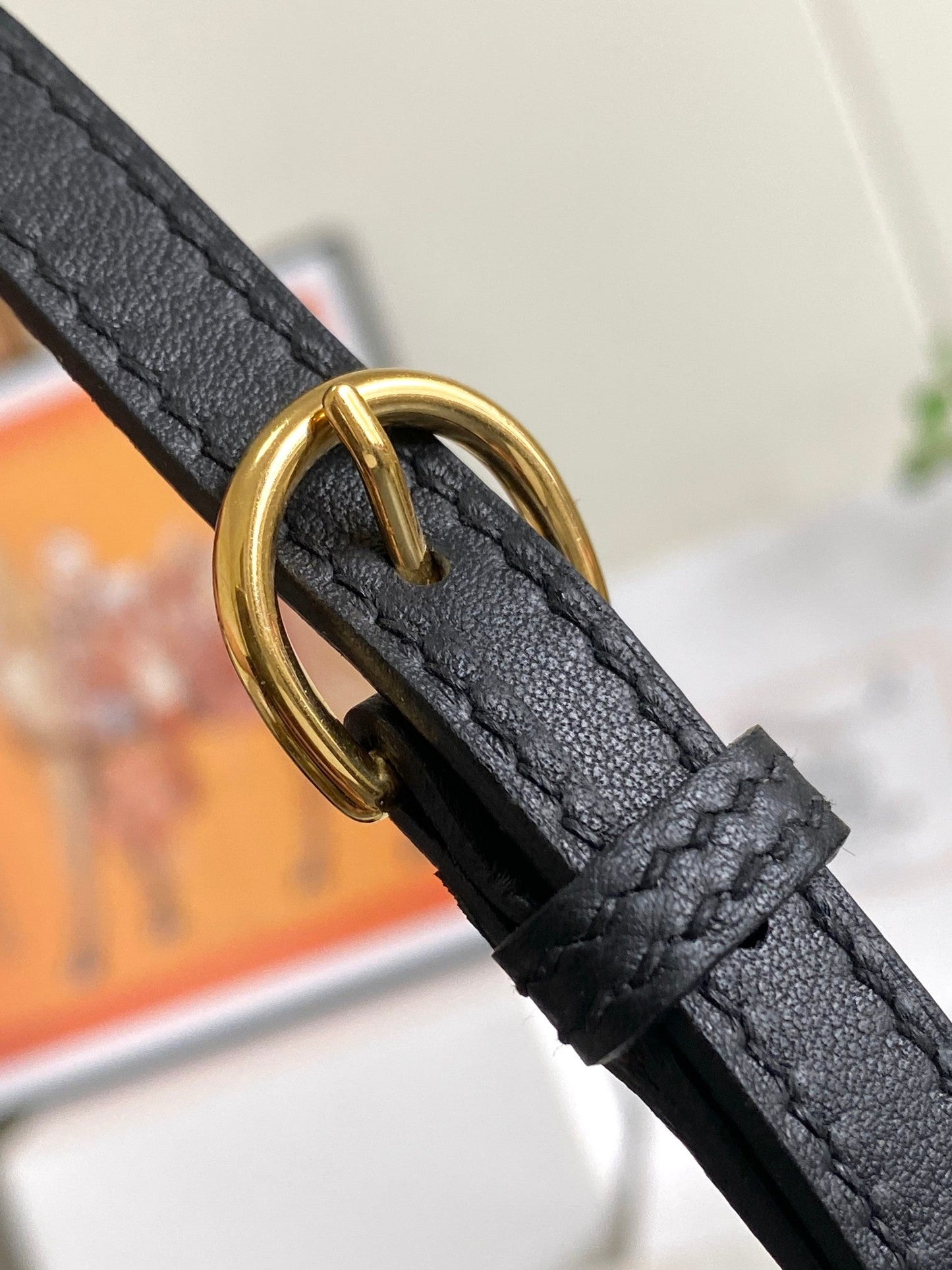 Bolso mini HM 24/24 de 21 cm, piel Evercolor negra, herrajes dorados