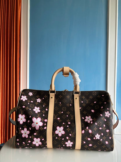 Bolso bandolera LV x TM Keepall de 45 cm con monograma Sakura Brown