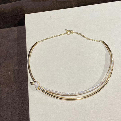 COLLAR DE DOBLE HILERA CON NUDO EN ORO AMARILLO CON DIAMANTES
