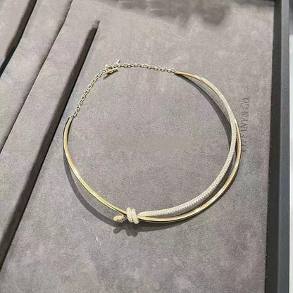 COLLAR DE DOBLE HILERA CON NUDO EN ORO AMARILLO CON DIAMANTES